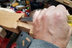 Chiseling the neck shape.