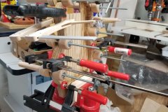 Gluing the top to the 'body harp'.