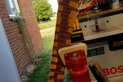 The binding is glued to the neck. The tape holds the binding tight to the fingerboard very well.