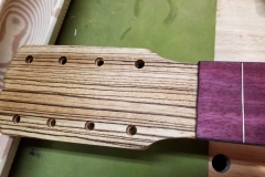 Tuner holes are drilled and countersunk.